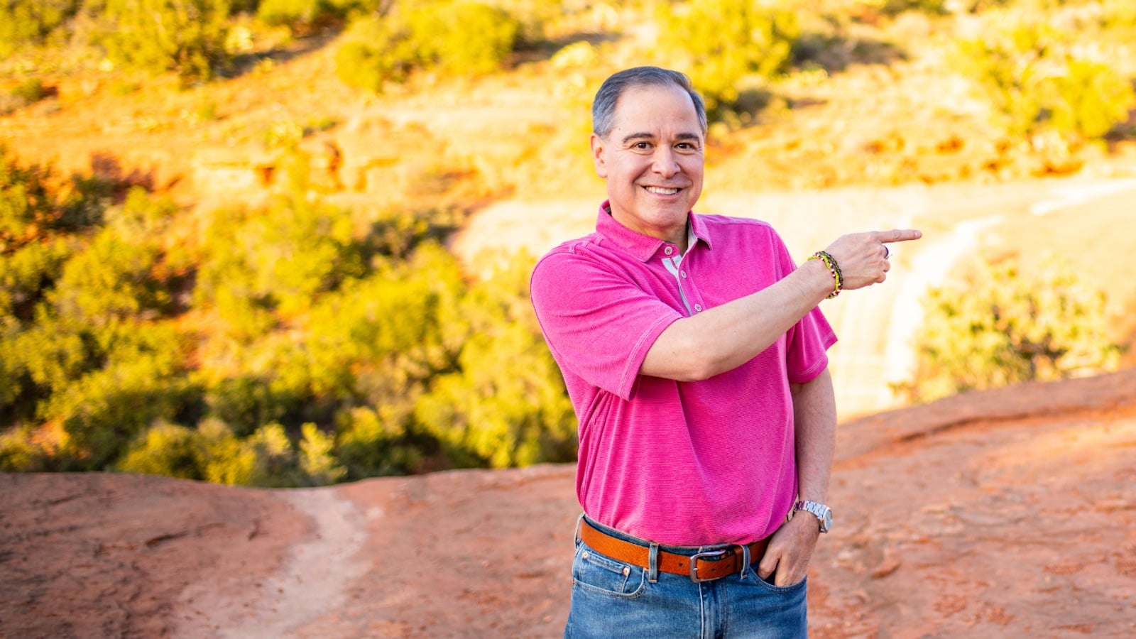 Jim Fortin outdoors, pointing